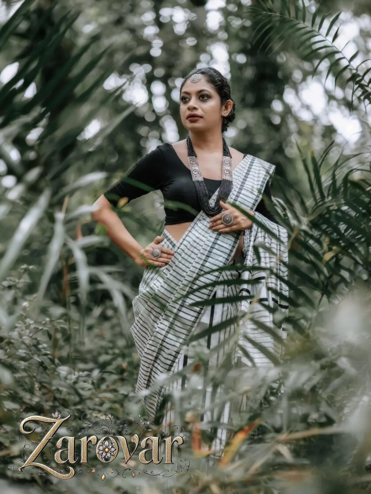 Silver tissue black lined set mundu