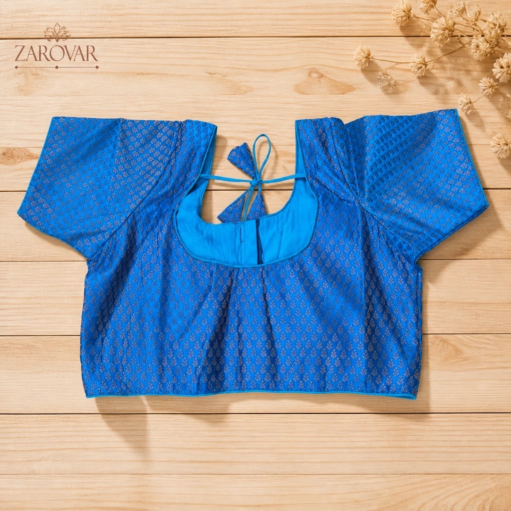 Ready-made brocade silk saree blouse features an elegant weave with a structured front-open pattern.