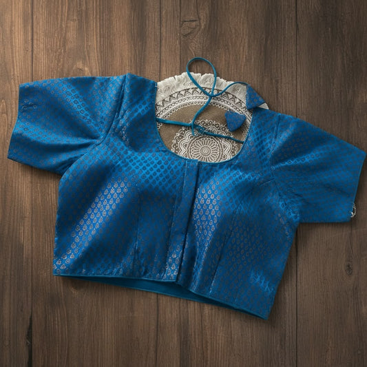 Ready-made brocade silk saree blouse features an elegant weave with a structured front-open pattern.